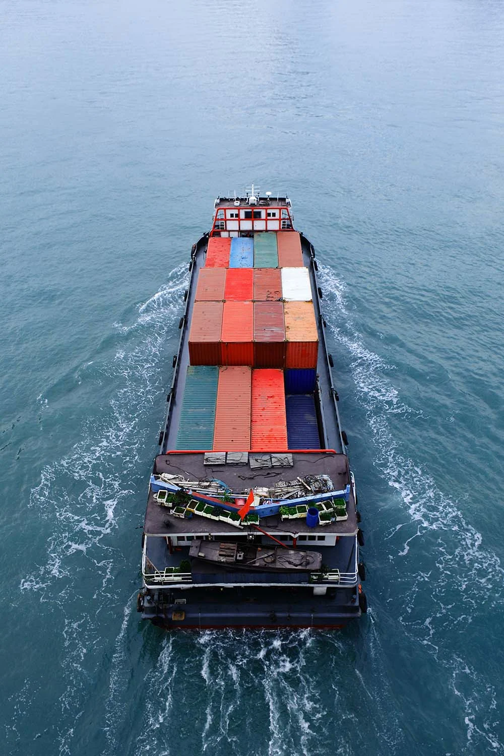 Aerial view of a cargo ship loaded with shipping containers
