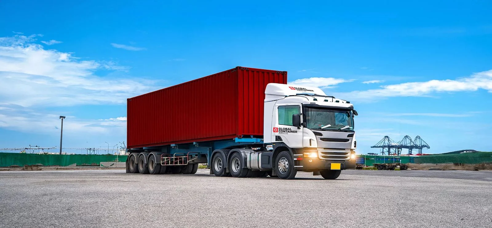 Global Containers sideloader truck moving a shipping container